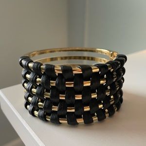 Leather and gold-colored cuff bracelet